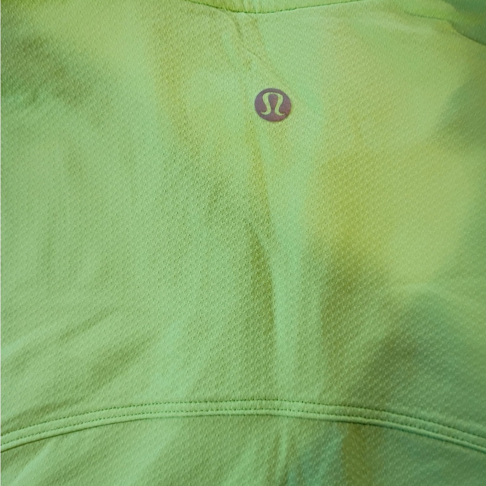 Bright neon green Lululemon sleeveless athletic top with half zip front. - Picture 6 of 7
